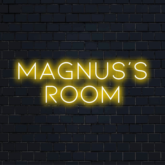 Magnus_s Room Custom Name Neon Sign, glowing lettering against black brick wall