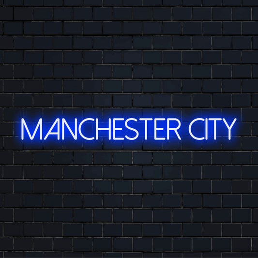 Manchester City Neon Sign, bright neon lettering on dark brick wall