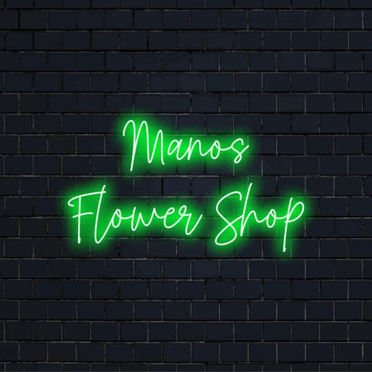 Manos Flower Shop Personalized LED Neon Sign, bright neon glow against black brick wall