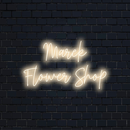 Marek Flower Shop Custom Name Neon Sign, glowing neon text on dark brick wall