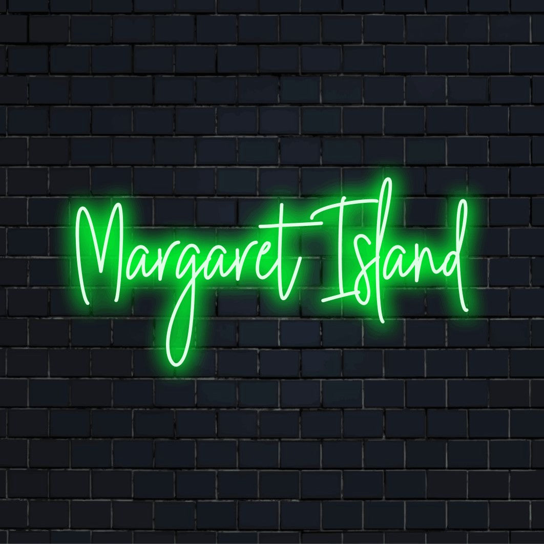 Margaret Island Neon Light with bright neon lettering against brick backdrop
