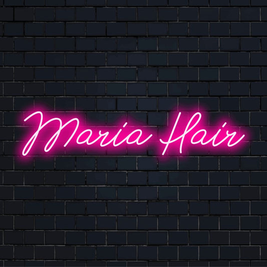 Maria Hair Personalized LED Neon Sign, glowing lettering against black brick wall