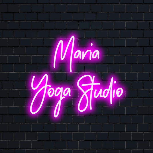 Maria Yoga Studio Personalized LED Neon Sign, glowing wall decor against brick backdrop