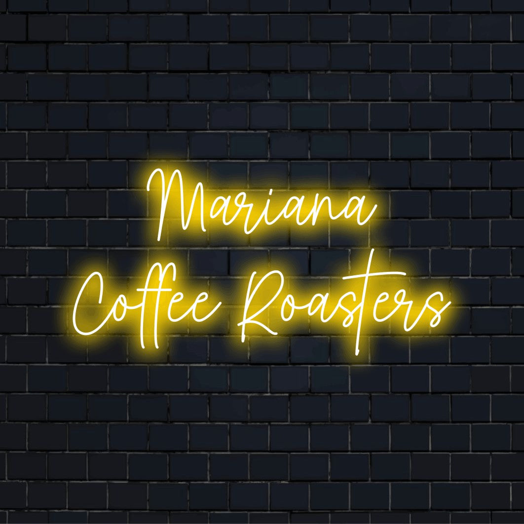 Mariana Coffee Roasters Personalized LED Neon Sign, glowing wall decor against black brick wall
