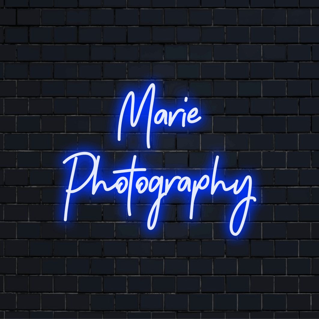 Marie Photography Personalized LED Neon Sign, glowing wall decor on dark brick wall