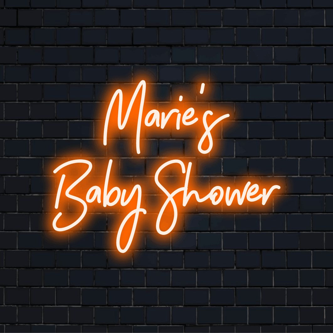 Marie_s Baby Shower Personalized LED Neon Sign, glowing wall decor on dark brick wall