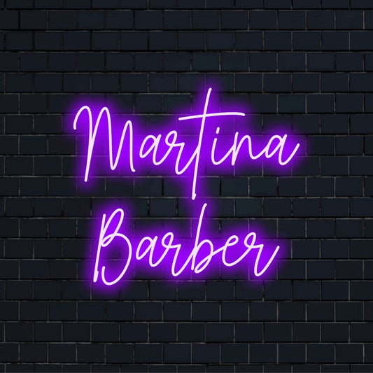 Martina Barber Personalized Neon Light with glowing neon text against black brick wall