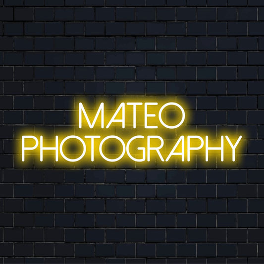 Mateo Photography Custom Name Neon Sign, bright neon lettering on black brick background