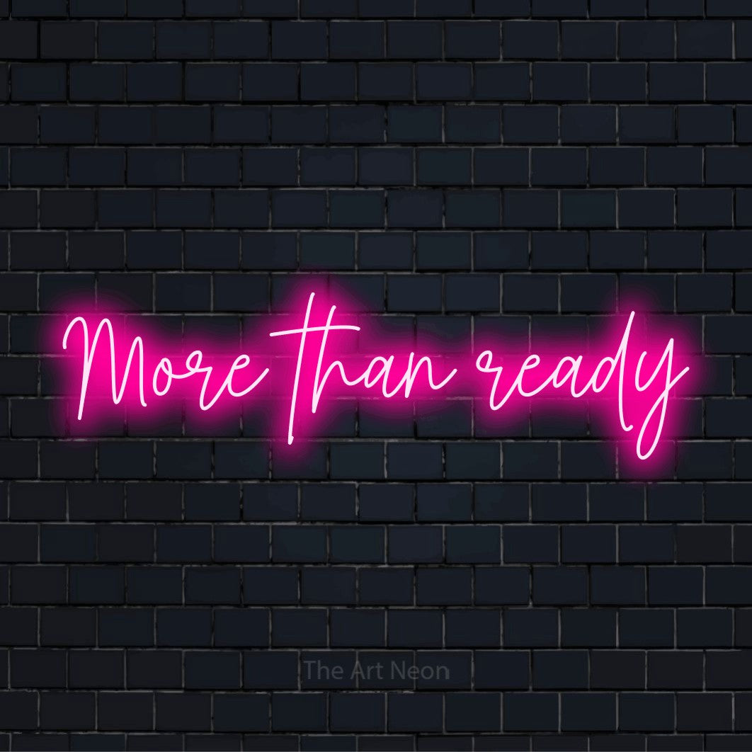 "More Than Ready" script-style LED neon sign on a black brick wall