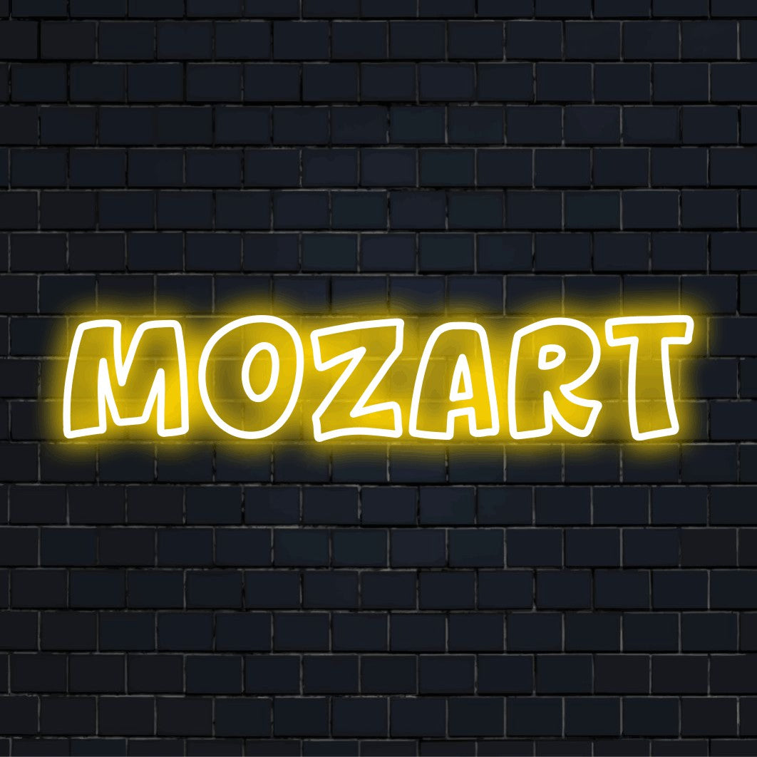 Mozart LED Neon Sign, glowing lettering against black brick wall
