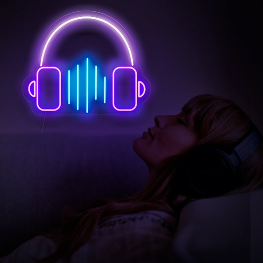 A vibrant neon sign featuring a pair of headphones and the word 'music' underneath