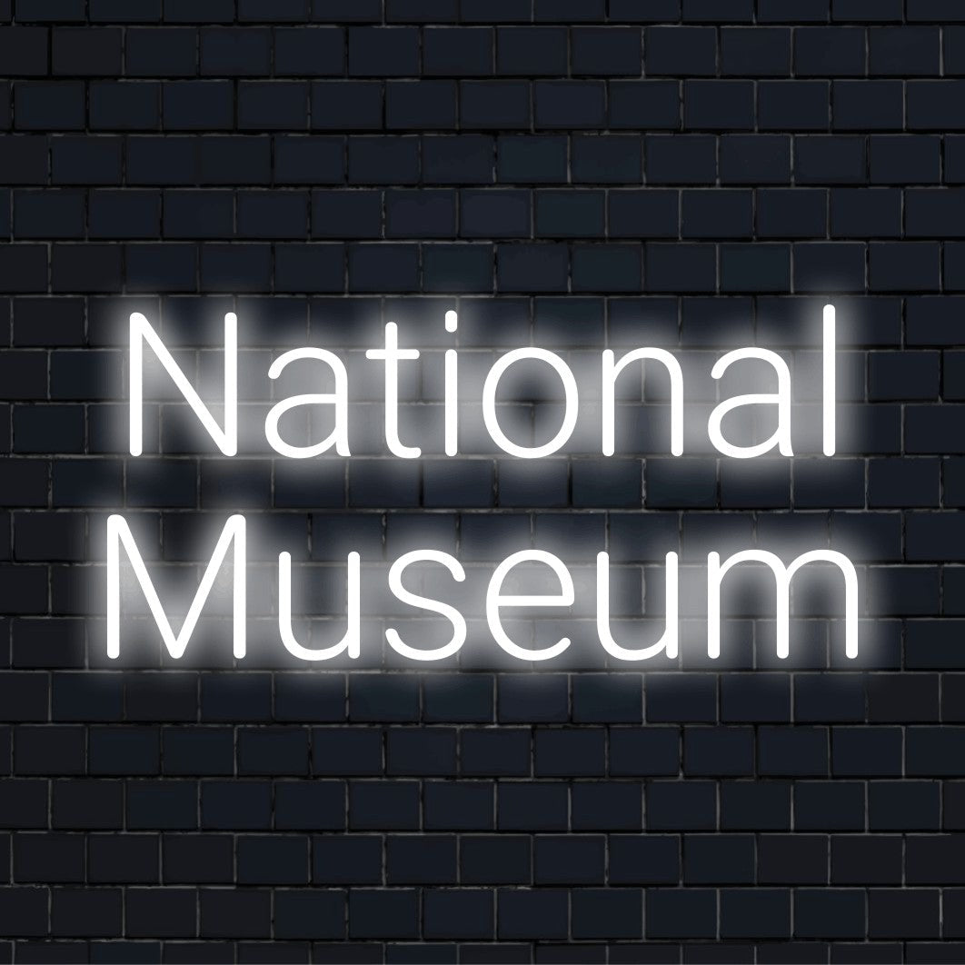 National Museum Neon Light with neon text light on dark brick wall
