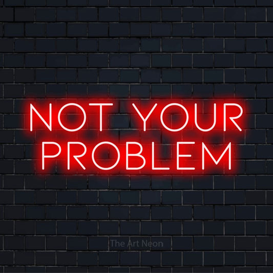 "Not Your Problem" script-style LED neon sign on a black brick wall