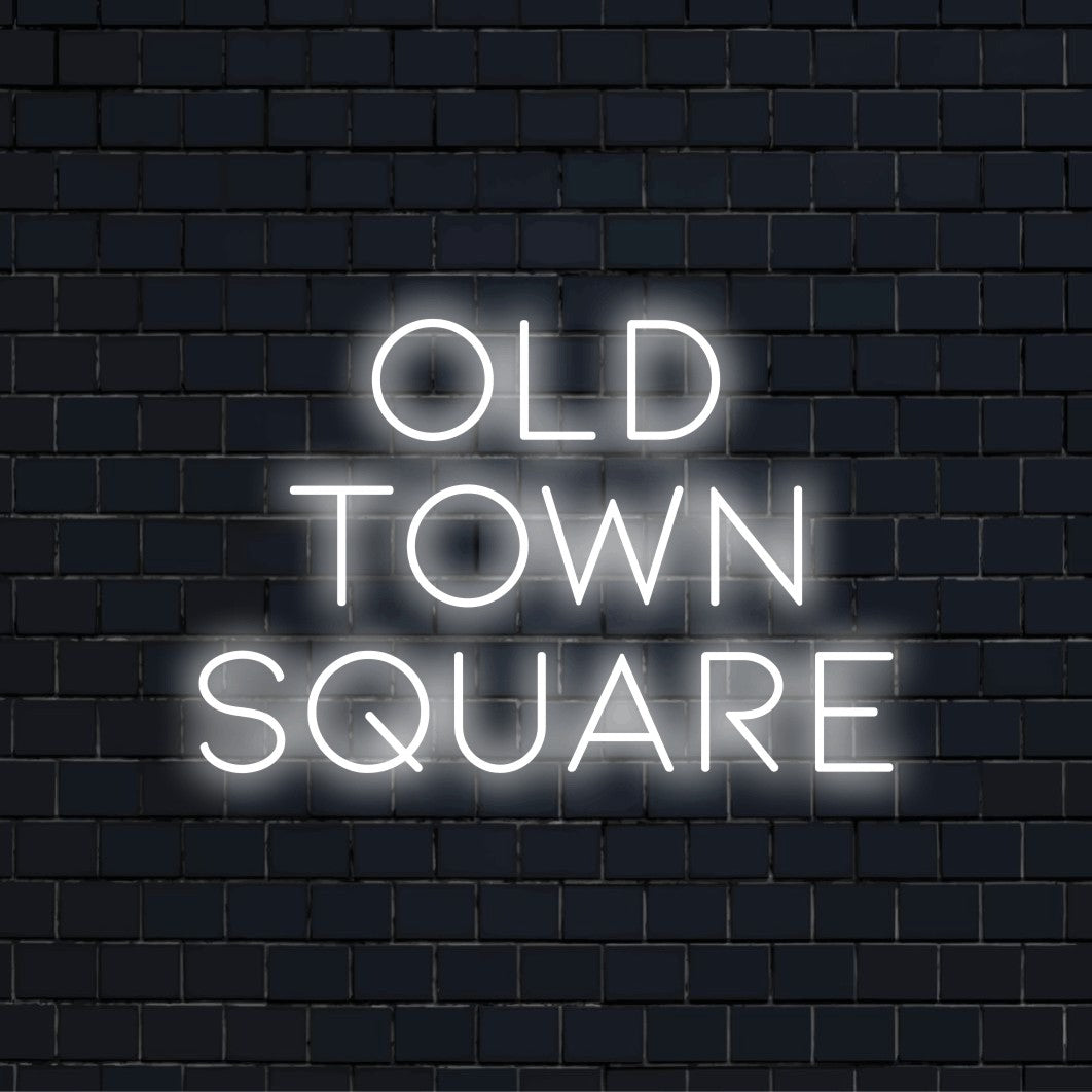 Old Town Square LED Neon Sign, glowing neon text against brick backdrop