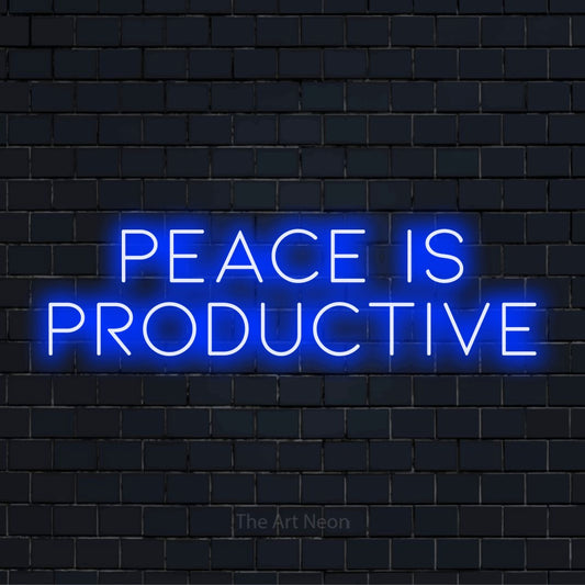 "Peace Is Productive" neon text design on a black brick wall