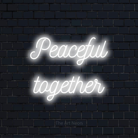 "Peaceful Together" LED neon sign on a black brick wall