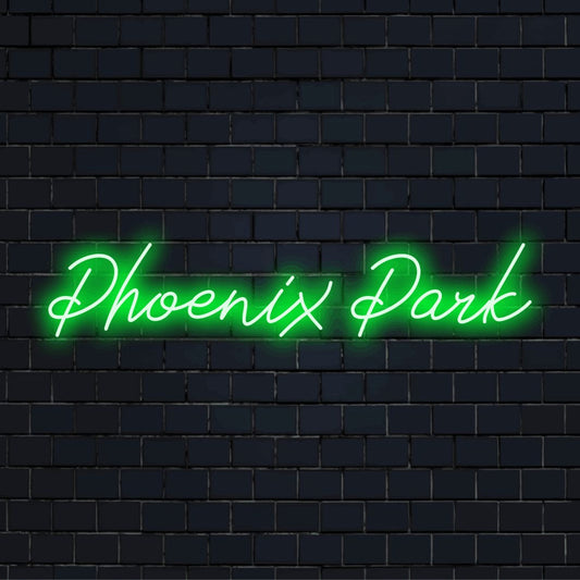 Phoenix Park Neon Sign, bright neon glow against brick backdrop