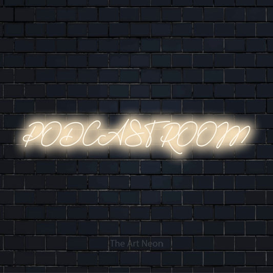 "Podcast Room" glowing LED neon sign on a black brick wall