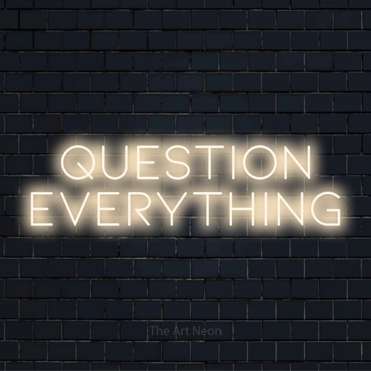 "Question Everything" text design with neon effect on a black brick wall