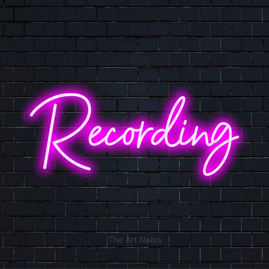 "Recording" glowing LED neon sign on a black brick wall