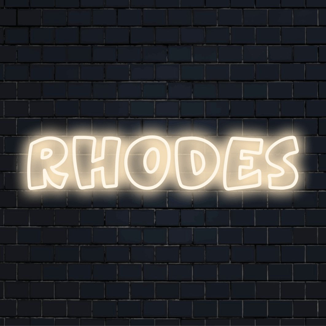 Rhodes Neon Light with bright neon lettering on dark brick background