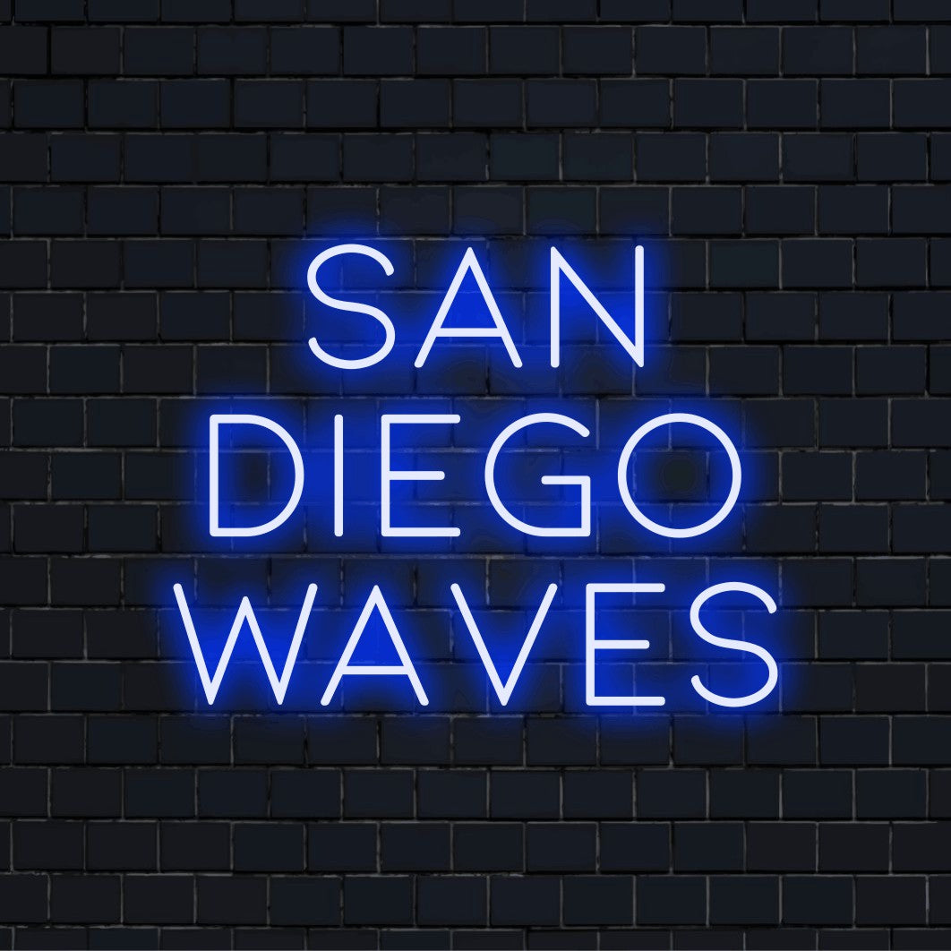 San Diego Waves Neon Light with glowing lettering on dark brick wall