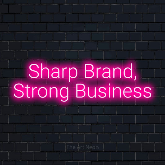 "Sharp Brand, Strong Business" LED neon sign on a black brick wall