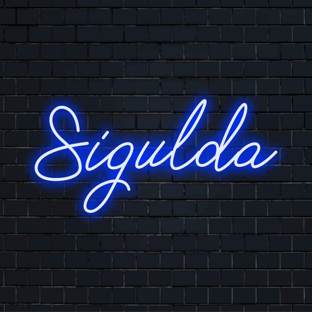 Sigulda Neon Sign, glowing neon text on dark brick wall
