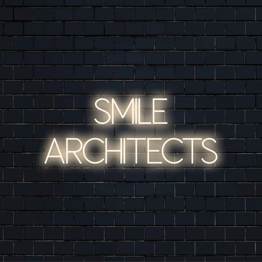 Smile Architects Neon Sign, bright neon lettering against black brick wall