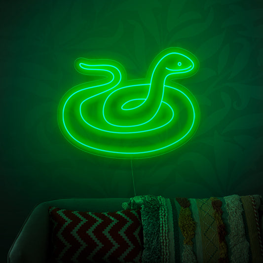 The snake neon sign is a mysterious addition to reptile-themed decor, casting an enigmatic and captivating light.