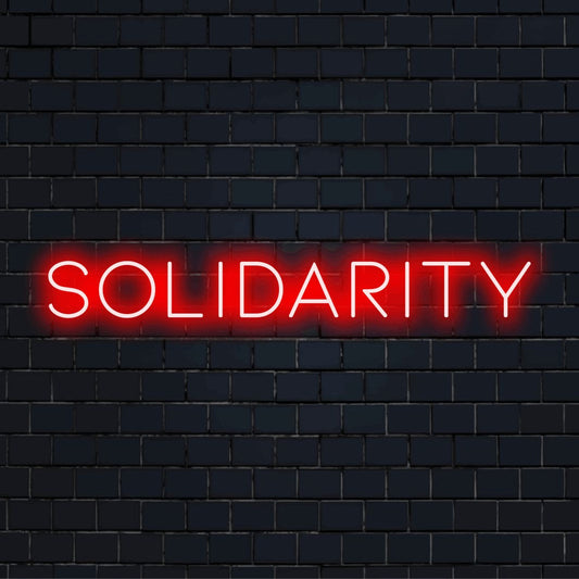 Solidarity Neon Sign, bright LED glow on dark brick background