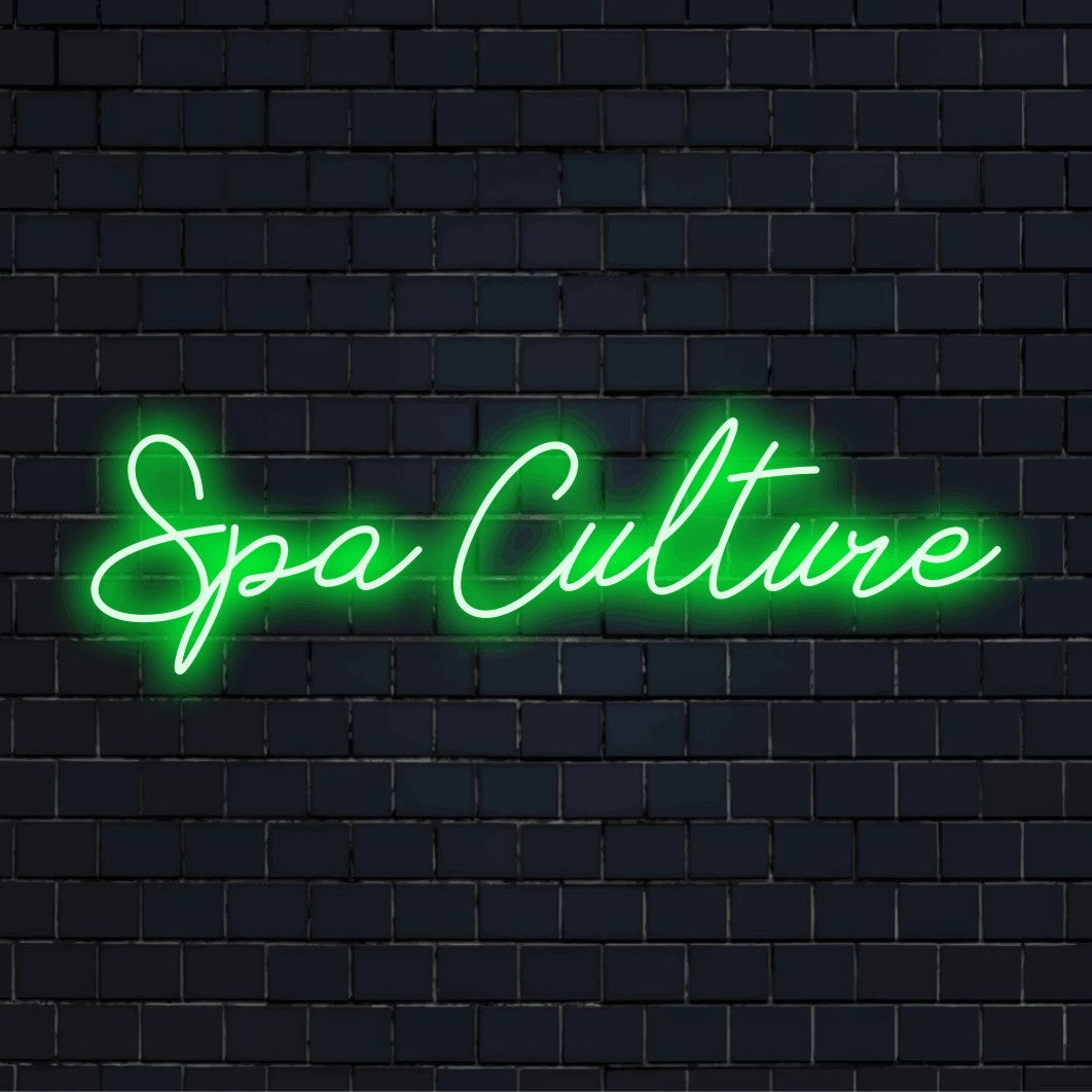 Spa Culture LED Neon Sign, soft neon glow against black brick wall