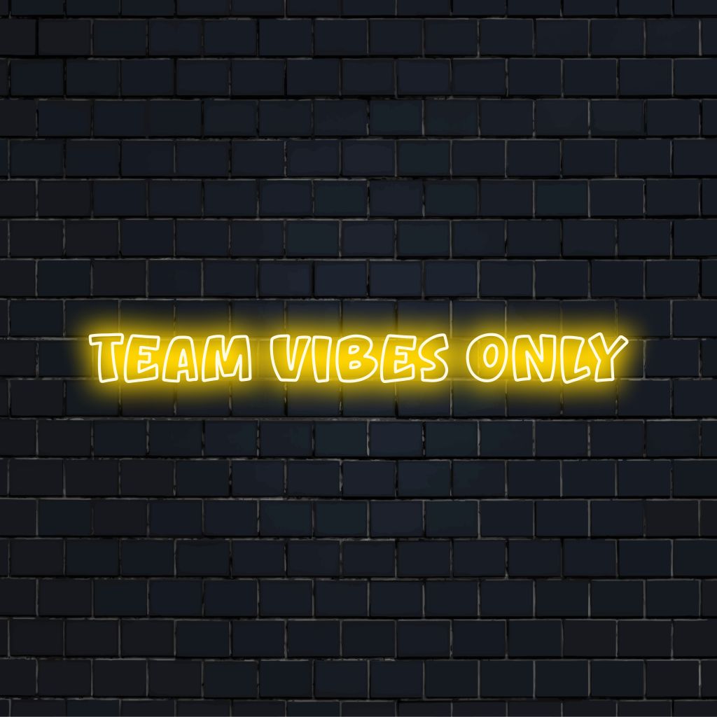 Team Vibes Only Neon Light with bright neon lettering against black brick wall