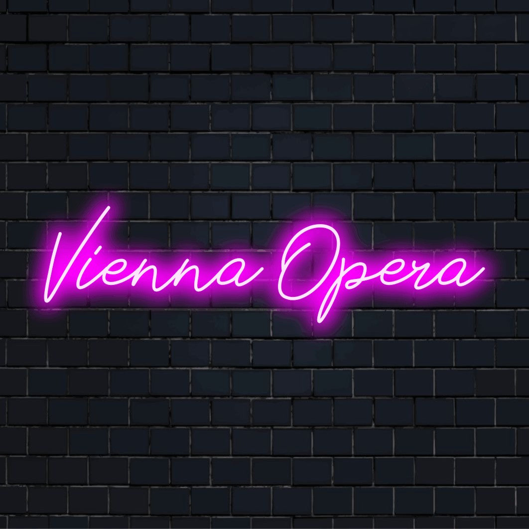Vienna Opera Neon Light with bright neon lettering against brick backdrop