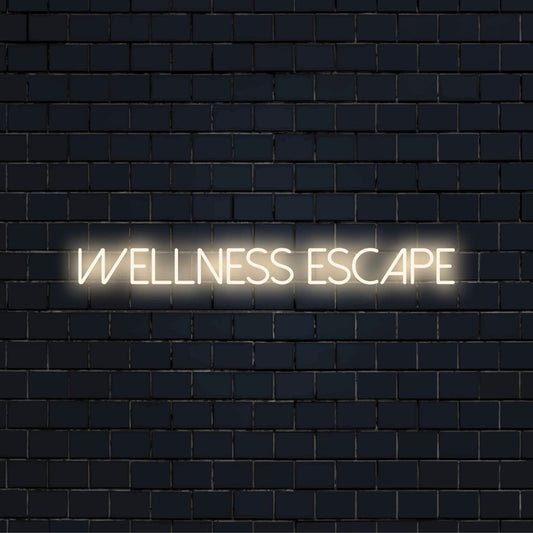 Wellness Escape Neon Sign, bright LED glow on dark brick wall