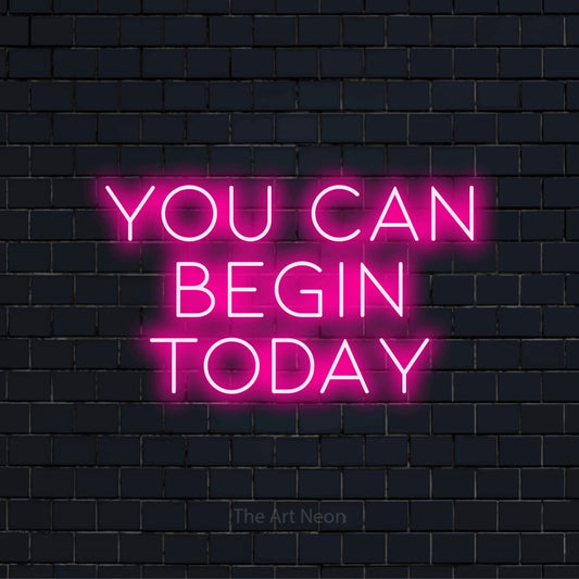 "You Can Begin Today" text design with neon effect on a black brick wall
