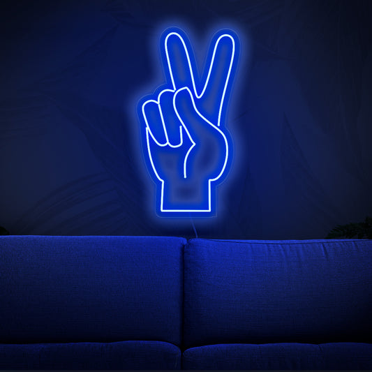 A vibrant neon sign featuring a hand making the peace symbol, representing a peace-themed decor with its colorful design. 
